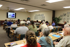 Stuart Haynes (standing) kicked off the workshop with topics pertaining to governmental organization and financial responsibilities. 