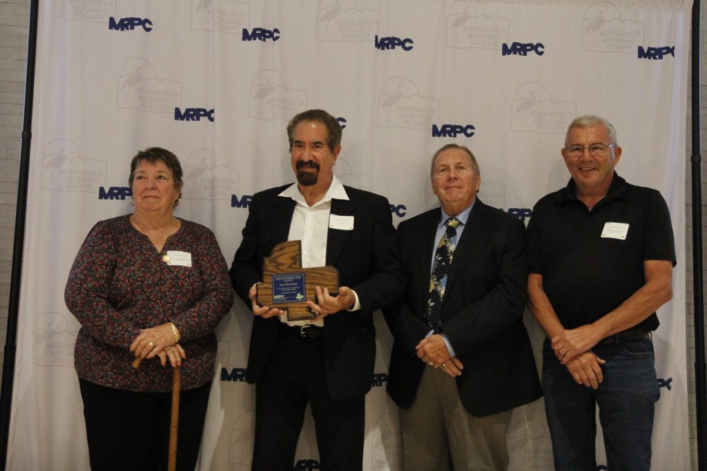 Stan Podorski, of Salem, was presented with Eugene E. Northern Service Award, the highest volunteer honor MRPC presents, by MRPC Board Chair Mary Heywood (left) and Vice Chair Darryl Griffin (second right) at the 2024 Annual Dinner and Awards Banquet on Oct. 24 in Linn. Podorski was nominated by Dent County Presiding Commissioner Gary Larson (right). 