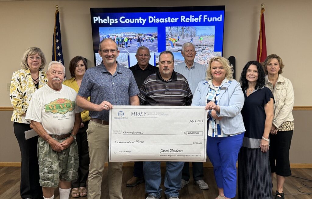 Matthew Evans with Choices for People accepts a $10,000 grant from the Phelps County Disaster Relief Fund for costs incurred as a result of the March 14 tornado in Rolla and Phelps County. Board members of Meramec Regional Community Foundation and the Phelps County Community Foundation made the grant award at the July 9 Annual Meeting of the MRCF. 