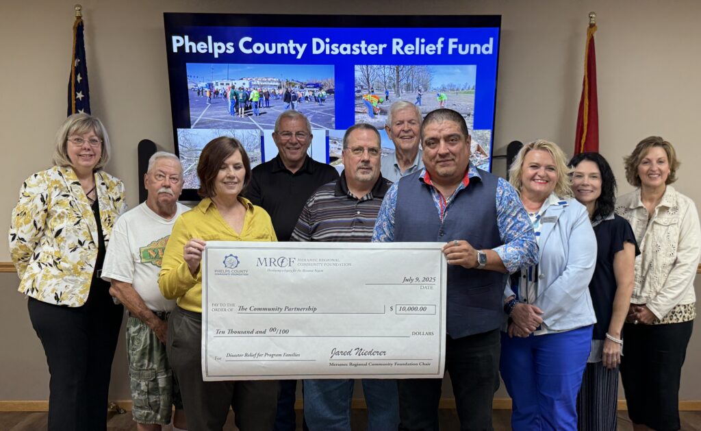 Sammy Rangel of The Community Partnership accepts a $10,000 grant from the Phelps County Disaster Relief Fund to assist families impacted by the March 14 tornado in Rolla and Phelps County. Board members of Meramec Regional Community Foundation and the Phelps County Community Foundation made the grant award at the July 9 Annual Meeting of the MRCF. 